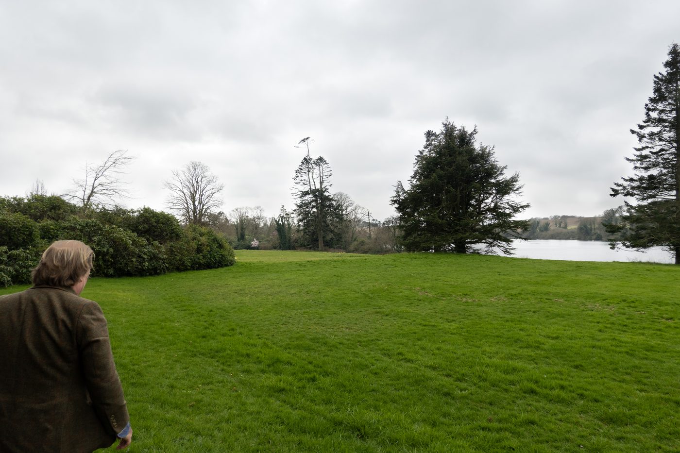 Finnian walking us out across the demesne lawn toward the lake.