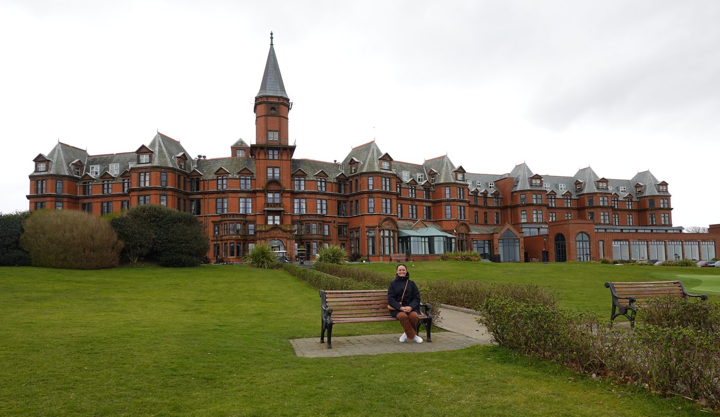 The Slieve Donard, a grand red-brick Victorian hotel, seen across its front lawn in Newcastle.