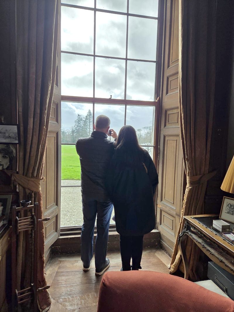 Doug and Tina at the window, photographing the same view.